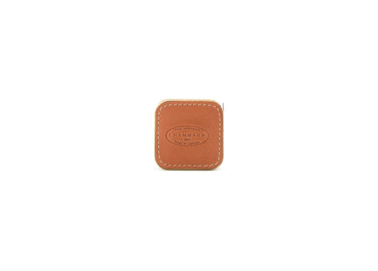 Closed F. Hammann 5205 Leather Tape Measure in Coxorange Alpina, viewed directly on a white background.