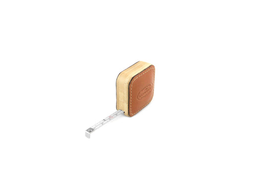 F. Hammann 5205 Tape Measure in Coxorange leather, with the 1-meter steel tape extended to show the scale.