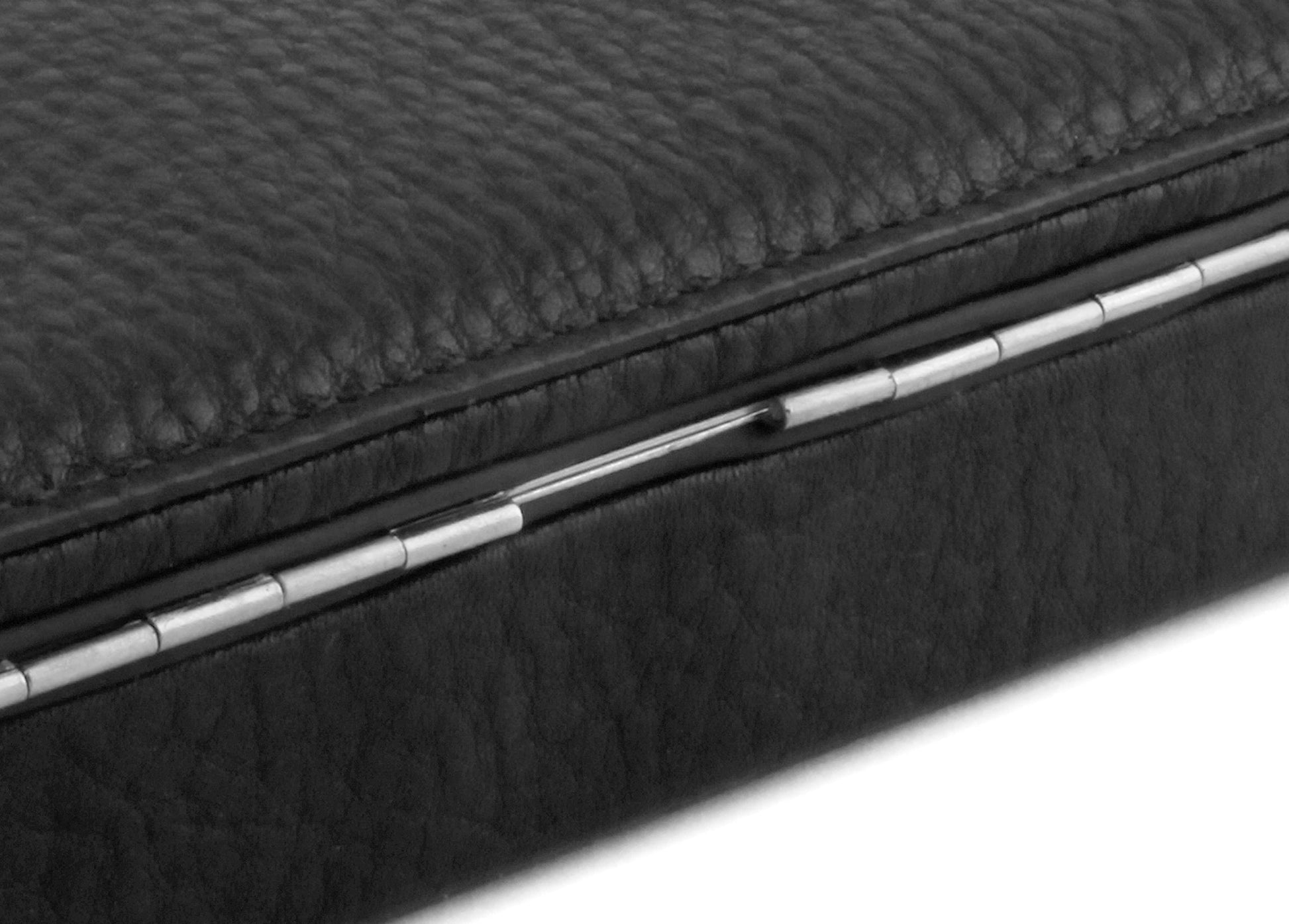 Close-up of the seamless silver piano hinge and textured black Chervo calfskin exterior of the 3976 Ruler Box.
