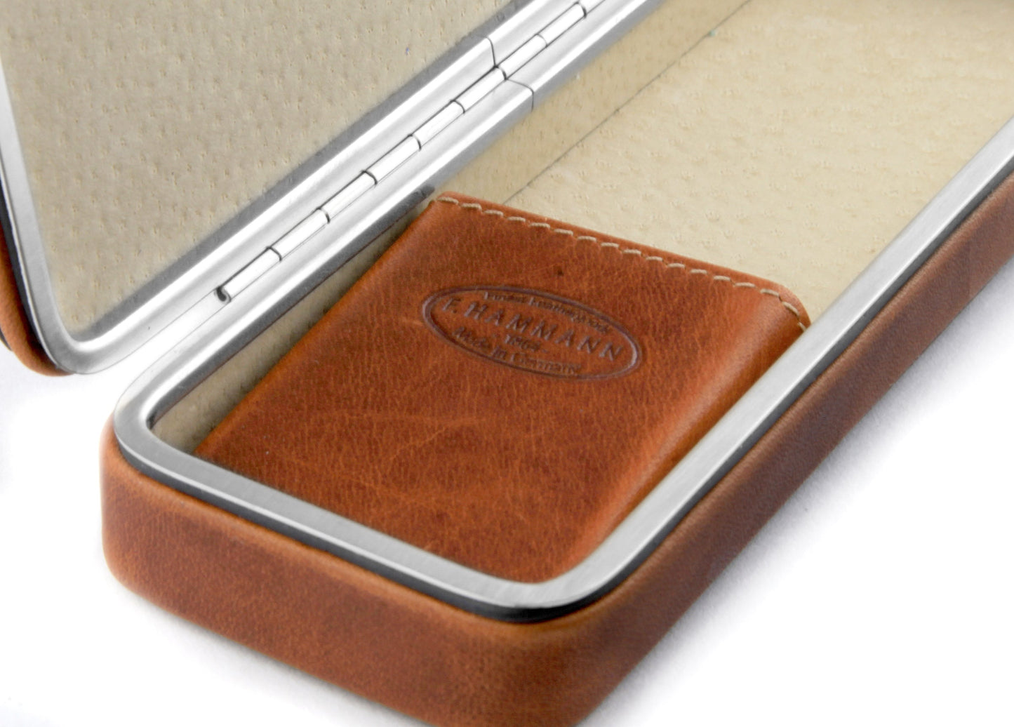 Detailed macro shot of the embossed F. Hammann heritage logo on the internal Coxorange leather bridge of the 3983 framed pen case.