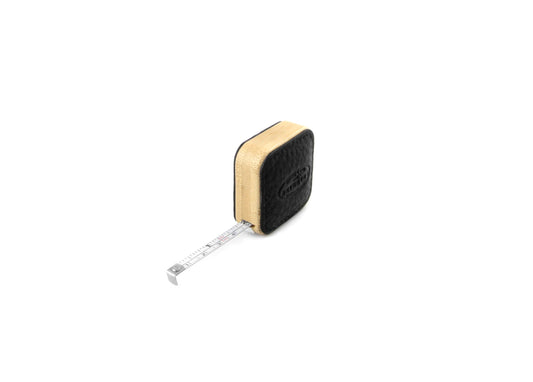 F. Hammann 5205 Tape Measure in Black Chervo leather, with the steel tape partially extended to show CM and INCH scales.