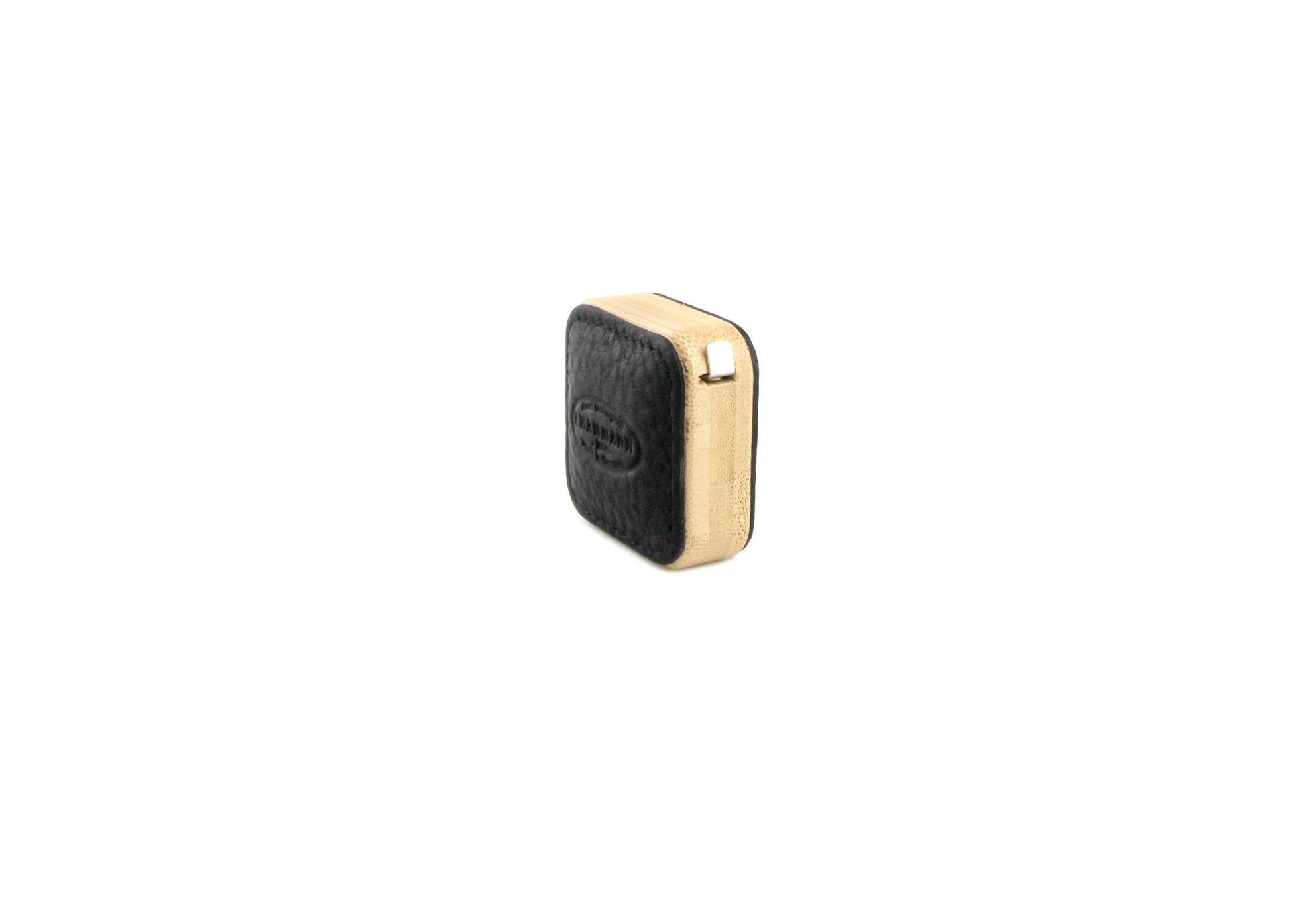 Angled perspective of the F. Hammann 5205 Black Chervo Tape Measure, emphasizing the pebbled grain and natural base.